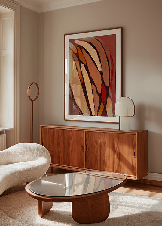 un salon moderne avec une grande peinture abstraite au mur, un meuble en bois, un canapé blanc et une table basse en verre.