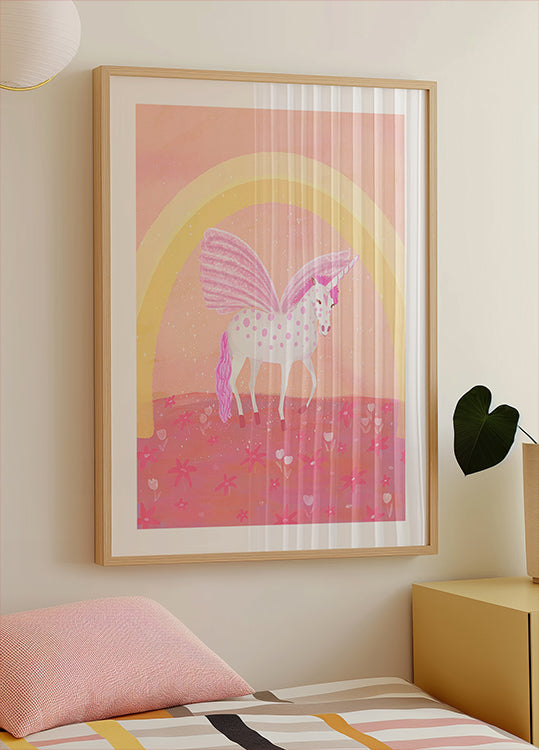 une affiche encadrée d'une licorne avec une palette de couleurs rose et blanche, sur un fond rose et jaune avec une arche arc-en-ciel.