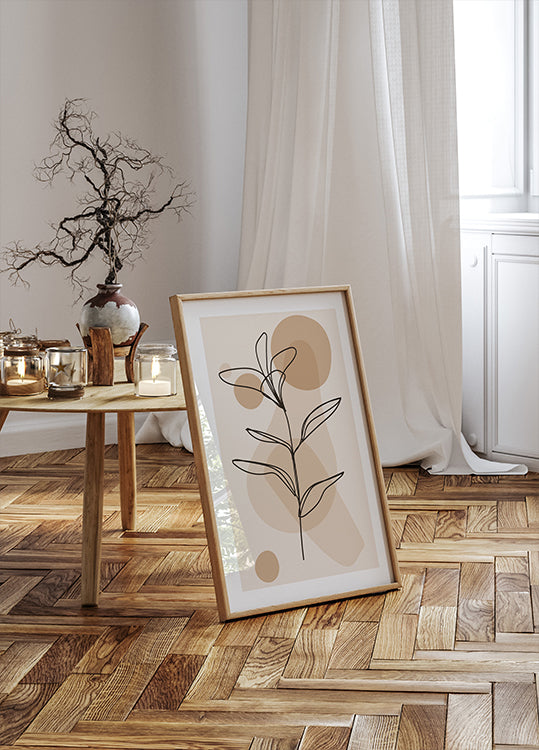 a picture frame sitting on the floor next to a table