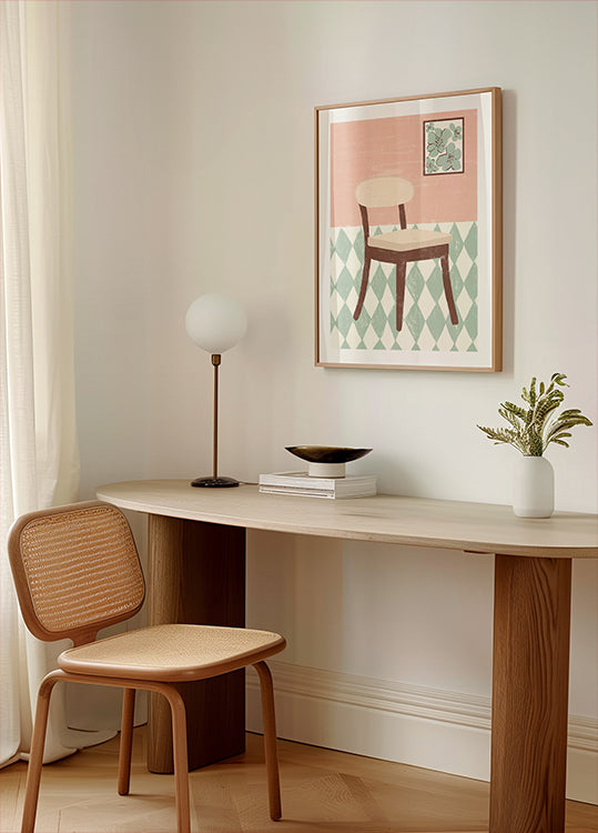 un coin confortable d'une pièce avec un bureau en bois, une chaise tressée, une lampe et une œuvre d'art encadrée représentant une chaise sur un sol à motifs.