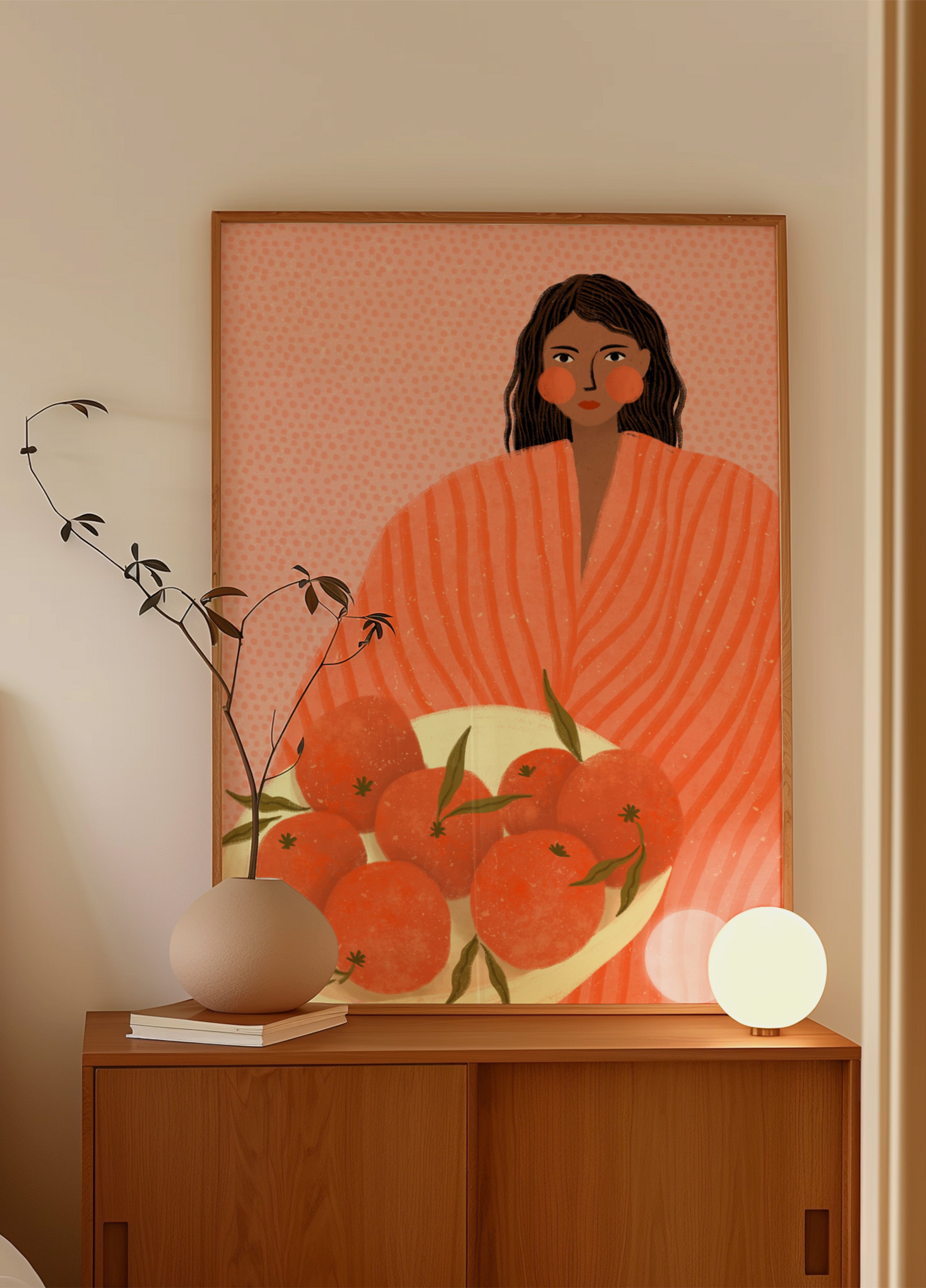 Femme tenant des oranges